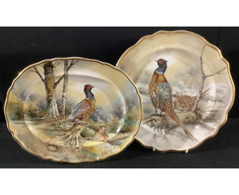 A Staffordshire Phildale cabinet plate, painted by P Worsdale, signed, decorated with game birds in a woodland; another oval,