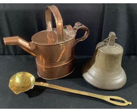 A 19th century copper watering can, 26.5cm high, c.1890;  a brass ladle, 41cm long;  a bell, 20cm high (3) 