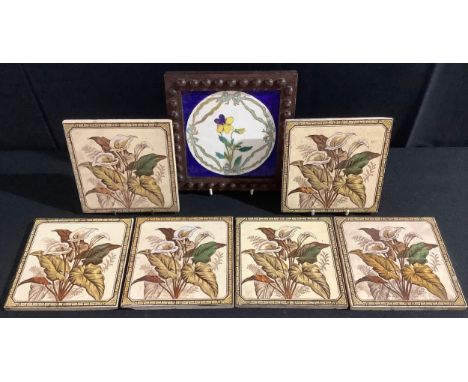 A Minton tile, painted by Edith S Hall, signed, dated 1877, printed and painted with a pansy pattern within Minton blue tied 