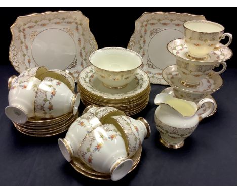 A Staffordshire Plant Tuscan China tea set for twelve, milk jug and sugar bowl, pair of sandwich plates 