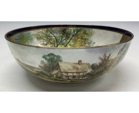 A Durley bowl, painted by James Skerrett, signed, the interior decorated with a Tudor style cottage with summer cottage garde