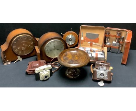 An oak mantel clock; another; a ship's wheel wall barometer; cameras; gentleman's travel sets; qty 