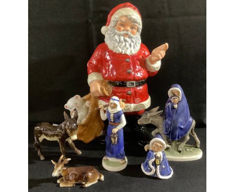 A large Goebel Weihnacht figure, Father Christmas, 35cm, printed mark; a Goebel nativity group of figures, Flight in to Egypt