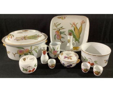 A Royal Worcester Evesham pattern large casserole dish and cover; other serving dishes, salt pot, vinegar bottle, egg cups, a