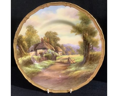 A Royal Worcester shaped circular cabinet plate, Offenham, painted by R Ruston, signed, rural view with cottage and sheep bei