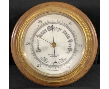 A 20th century brass barometer, James Barker and Co, Kensington, oak mount, 26cm diam 