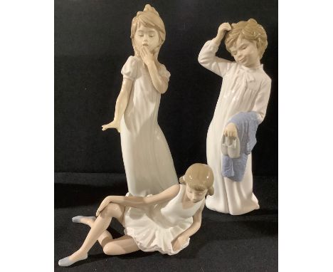 A Nao by Lladro figure, girl holding slippers, 27cm high; others, Sleepy Time, Ballet Girl (3) 