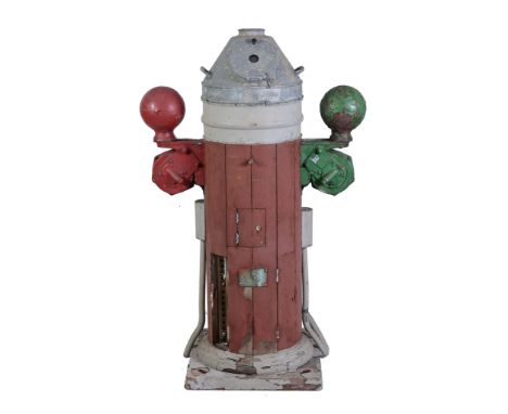  A ships binnacle,   the galvanised hood enclosing the binnacle compass flanked by red and green navigation balls and mounted
