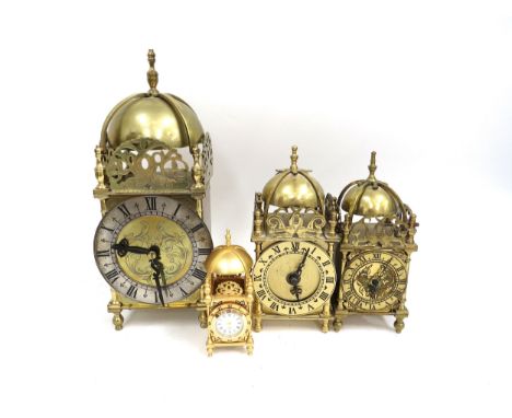 Three brass cased lantern clocks and a miniature gilt metal contemporary example by The Franklin Mint. Two with modern batter