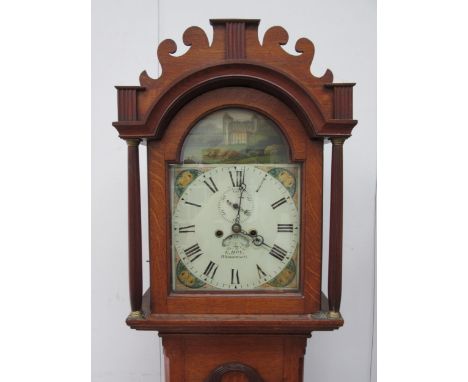 An early 19th Century oak cased longcase clock by E. hoy of Whissonsett, painted arch dial with gilt flower corner decoration