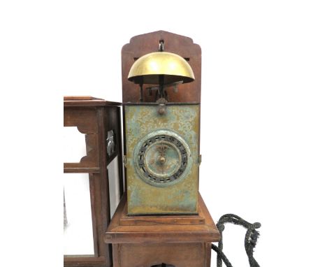 Wadokei: An 18th Century Japanese Hashira-Dokei lantern clock with hooded wooden wall bracket. Brass and iron case, with the 