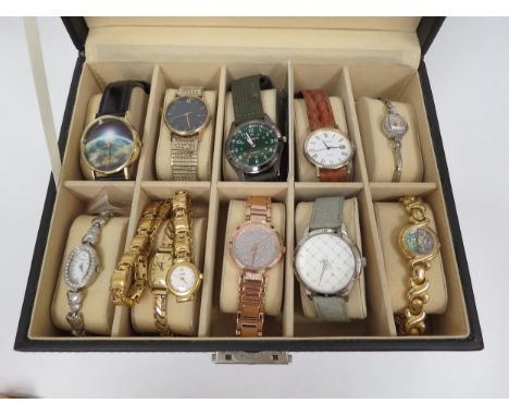Eleven various wristwatches including Pulsar, Citron, Accurist, Timex, Imagio, etc. together with two watch display cases.