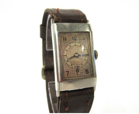 OMEGA: A mid 20th Century Art Deco Omega Tank case watch, metal dial with chapter ring and outer Arabic numerals, with subsid