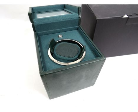 A Wolf single automatic watch winder in green, with original box and purchase receipt, including cables, owners manual and wa