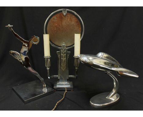 A 1930s chrome table lamp, together with a reproduction model aircraft and a nude woman lamp holder. (3)