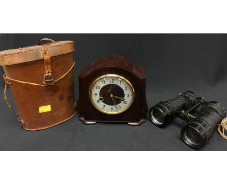 A pair of World War two binoculars, B.H & G ltd, 1944, OS/997, in leather carry case, together with a Bakelite mantel clock b