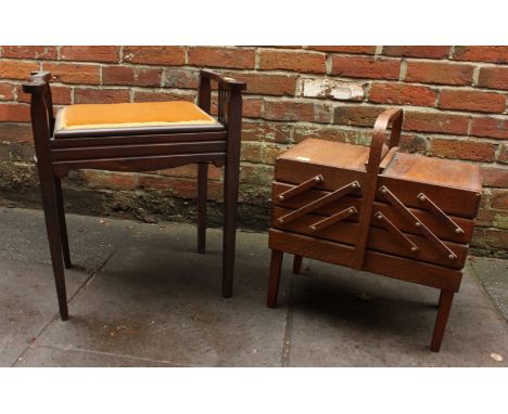 An Edwardian stained beech piano stool with folding top and supported on square legs, together with a folding sewing box. (2)