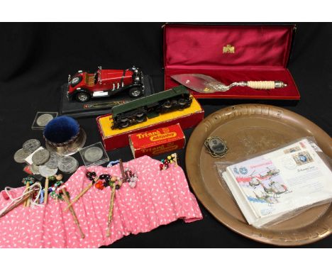 A group of assorted items including a silver pin box, a silver plated cake silver, a collection of bobbins, a collection of c