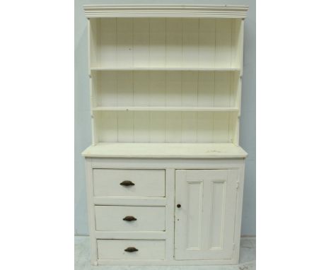 A painted pine kitchen dresser, with inverted cascading two-shelf planked back, above three drawers and a single cupboard, 12