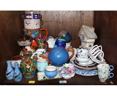 SECTION 35. A shelf of assorted china including Torquay ware and other items.