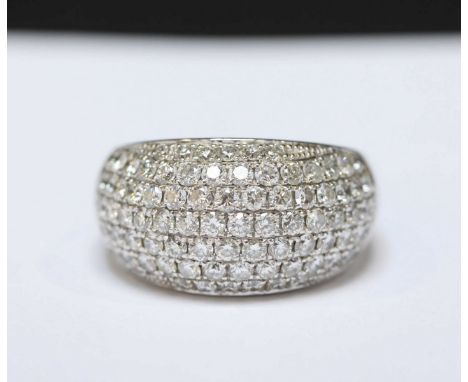 A 9ct white gold and diamond dress ring, pavé set with seven rows of diamonds in a plain white gold mount, marked .375.