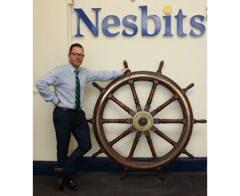 A large 19th century ten-spoke oak ship's wheel with cast iron hub with brass cap and brass ring, 165cm (65 inches) diameter 