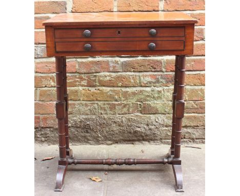 An early 19th century mahogany work table, the plain rectangular top over single drawer with dummy drawer verso, supported on