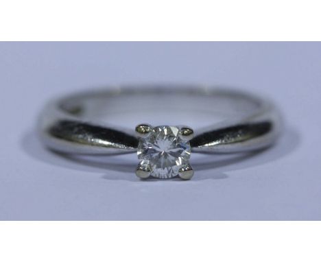 An 18ct white gold and diamond solitaire ring, set with diamond weighing approx.. 0.20cts, set in a plain 18ct white gold.