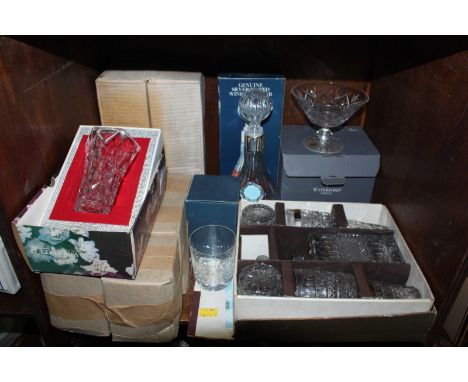 SECTION 55. A shelf of assorted cut crystal and glassware, including  decanters and glasses.