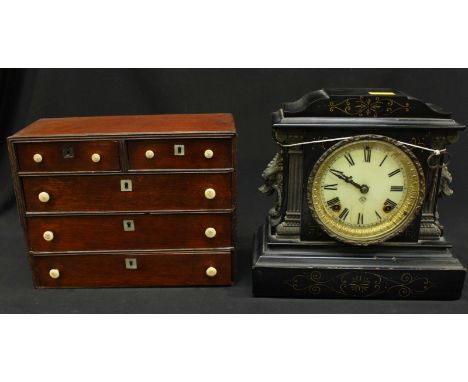 A late 19th century mahogany miniature chest of two short and three long drawers with turned bone handles and mother of pearl