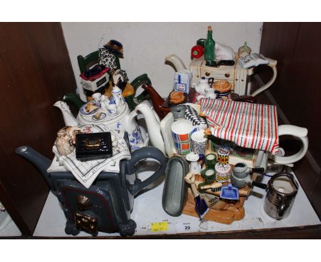 SECTION 20.  A collection of six various novelty ceramic teapots, mostly by 'Cardew design' one modelled as a chopping block.