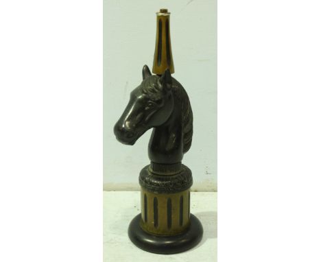 A contemporary horses head table lamp base, supported on a reeded pedestal foot.