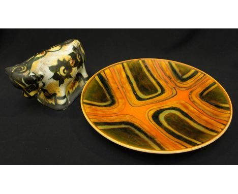 A Poole Pottery orange glaze studio charger. 34.5 cm diameter and a Celtic Pottery Bull. (2)