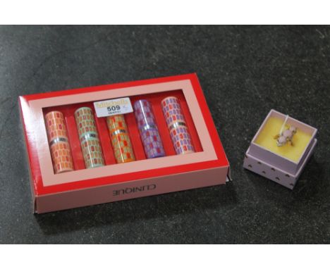 Boxed set of Clinique lipsticks and pink opal ring 