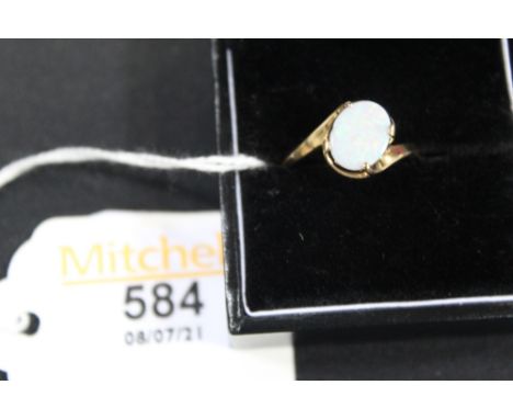 A 9 ct gold oval opal double twist ring Size P