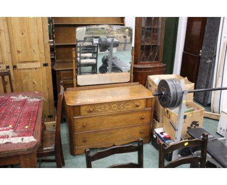 A 20th Century oak carved dressing chest