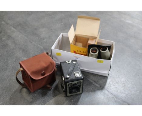 Pair of binoculars and a box camera 