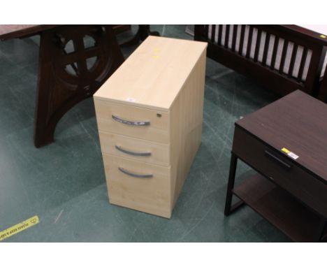 A modern narrow and deep three drawer filing chest