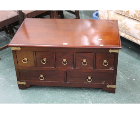 A modern rectangular low chest of 7 drawers.