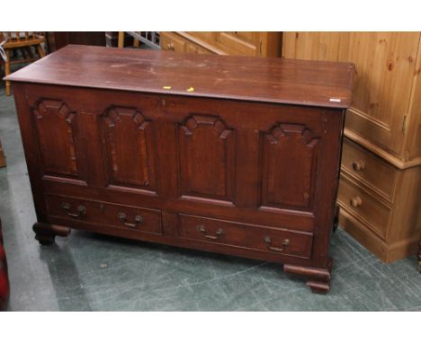 An 18th century panelled oak mule chest with four fielded and crossbanded panelled front, 84 cm high, 136 cm wide