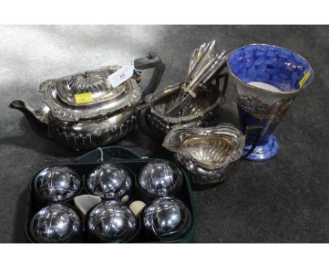 A set of boules, maling vase, three piece silver-plated tea service and a set of o'dourve knifes and forks with silver handle