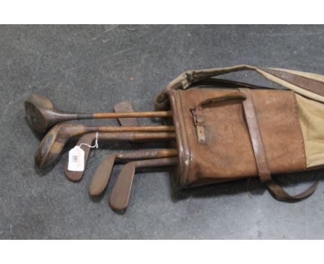 Bag of vintage golf clubs 