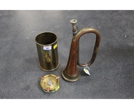 A brass and copper bugle and various pieces of trench art