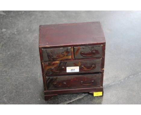 A Japanese lacquered miniature chest of drawers 2/2, height 22 cm