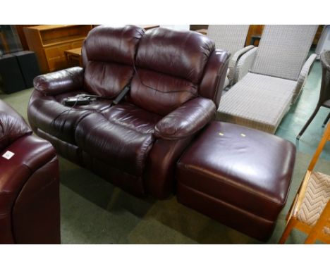 Oxblood two seater electric reclining settee with similar footstool