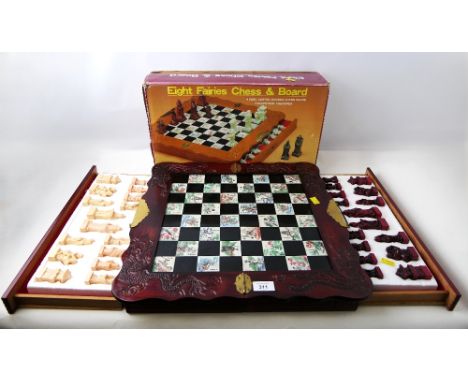 Boxed Oriental themed Eight Fairies Chess and Board set with hand carved wooden chessboard and soapstone chessmen