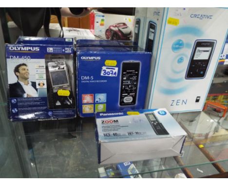 A set of three dictaphones to include a Panasonic, an Olympus DM-450 2gb, an Olympus DM-5 digital voice recorder and a Creati