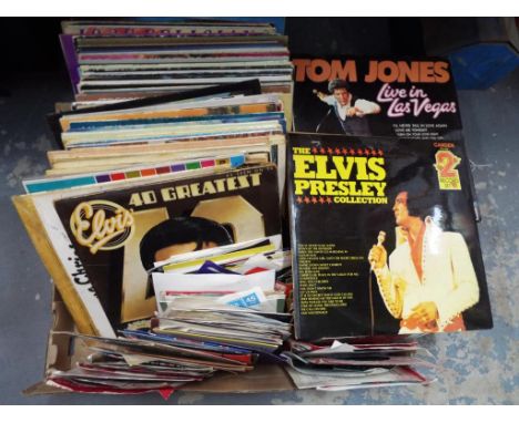 A very large quantity of 33.3 vinyl record albums and vinyl singles to include Tom Jones, Elvis Presley, Perry Como and simil