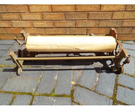 A vintage wallpaper roller