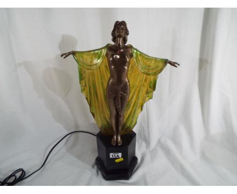 An Art Deco style lamp in the form of a lady with a green and yellow cloak, Est £80 - £120